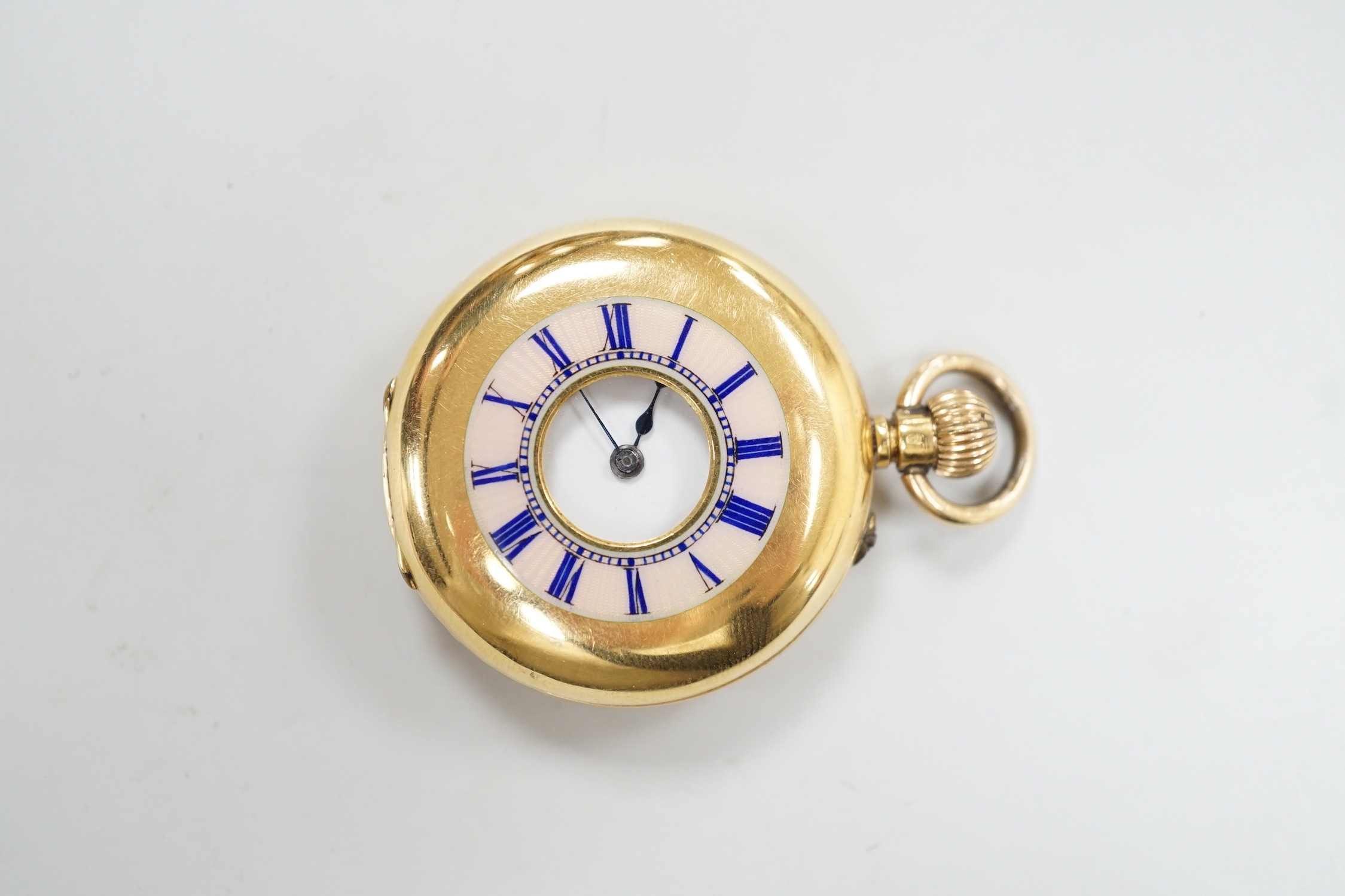 An 18k yellow metal and guilloche enamelled half hunter fob watch, with Roman dial, case diameter 34mm, gross weight 33.7 grams, the case back with engraved monogram.